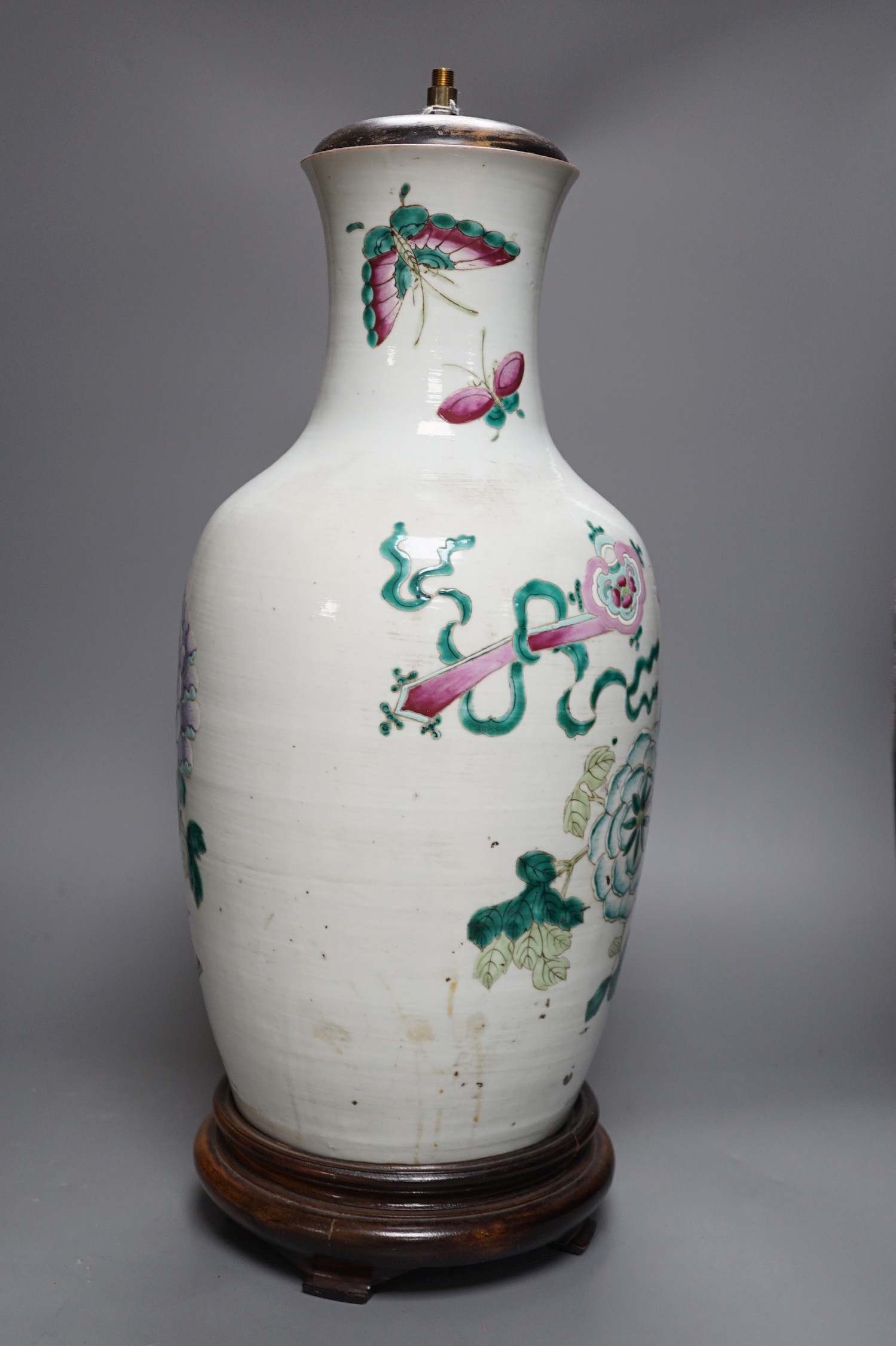 A large Chinese famille rose ‘peony and rockwork’ vase, converted into a lamp on wooden base, 53cm tall